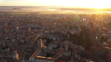 Epic-mystic-foggy-aerial-sunrise-over-Arles-southern-french-town-romanesque